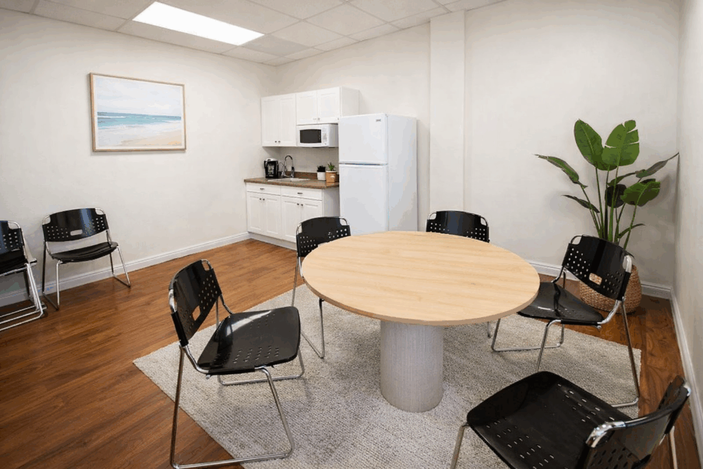 Modern tenant lounge with comfortable seating, clean design, and a welcoming shared space.