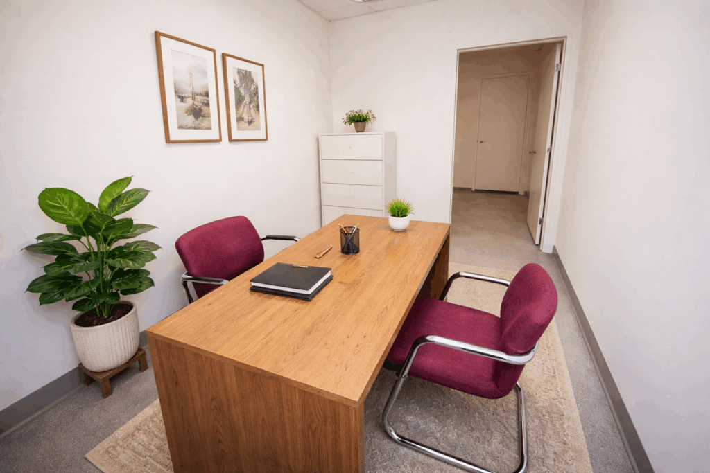 Modern professional office workspace with clean design, contemporary furniture, and natural light.